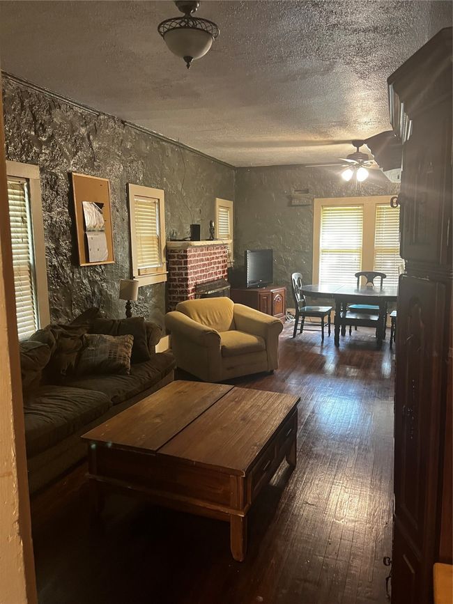 Open, spacious living area with fireplace | Image 8