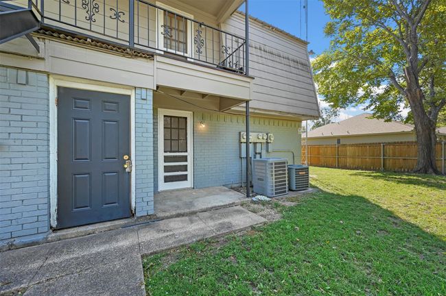 View of exterior entry featuring a balcony and brick siding | Image 16