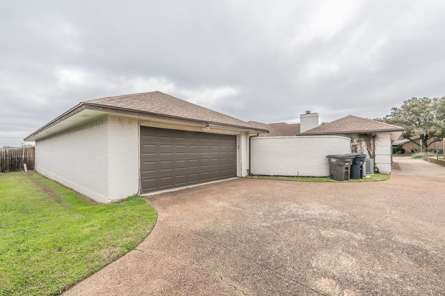 Unit 4904 View of home's exterior featuring a lawn | Image 40
