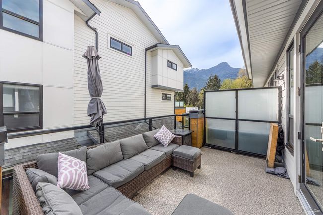 View of patio with a mountain view and an outdoor living space | Image 15