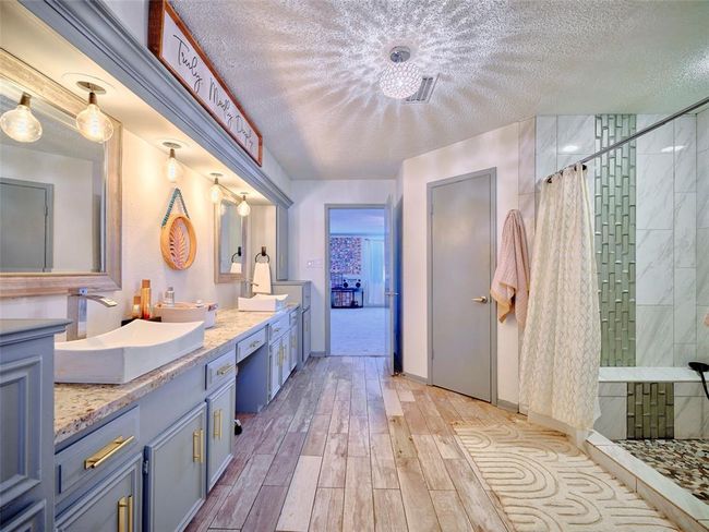 Updated countertops, sinks, and fixtures create a serene experience. | Image 22