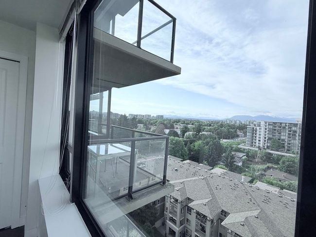 Balcony with a view of city and a mountain view | Image 13