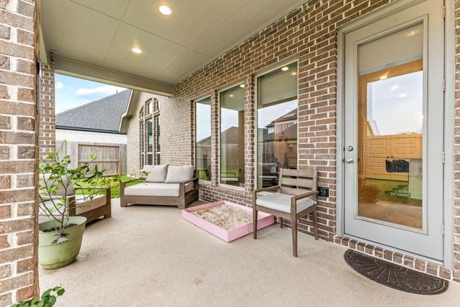 Come and see this spacious backyard with its beautiful covered patio. There is plenty of room for the kids to play and adults to relax! Perfect for your outdoor living space, patio furniture, bbq pit, and so much more. The possibilities are endless! | Image 18