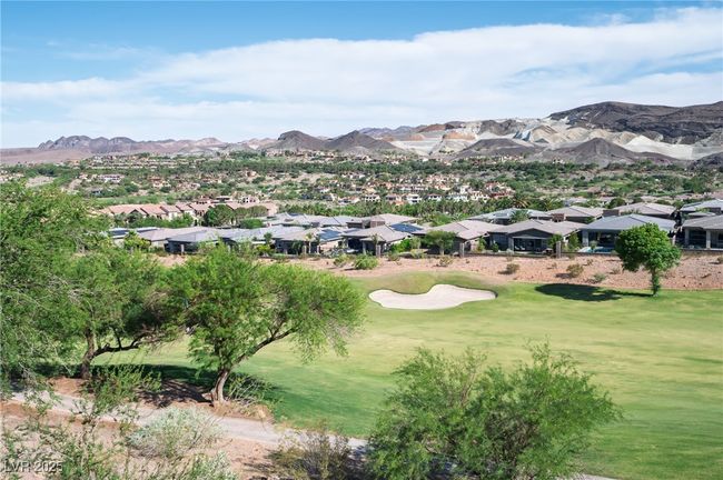 View of mountain background featuring nearby suburban area and a local golf course | Image 25