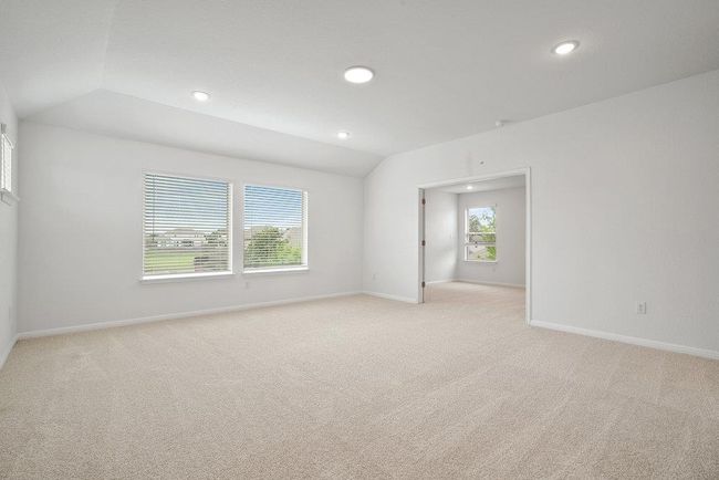 Empty room with vaulted ceiling, light carpet, and recessed lighting | Image 12