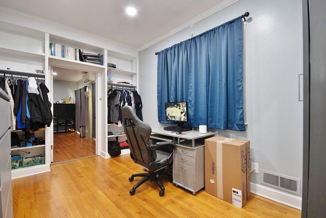 Office has hardwood floors and door to Family Room | Image 16