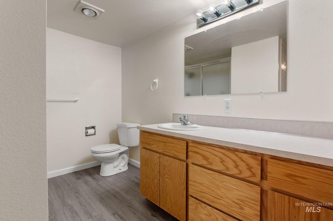 Full bathroom with vanity, wood finished floors, and an enclosed shower | Image 31