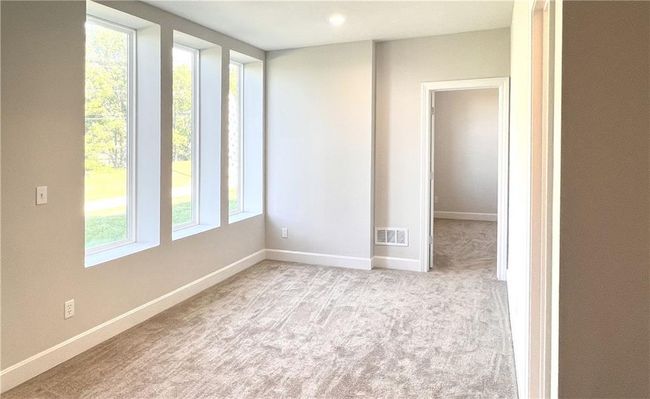 Carpeted spare room with baseboards | Image 40