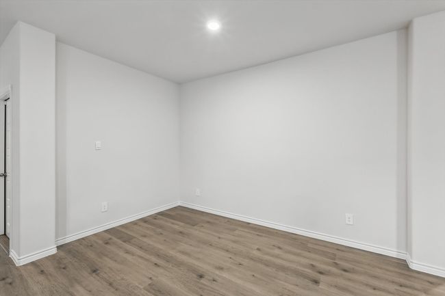 Spare room with wood finished floors and recessed lighting | Image 11