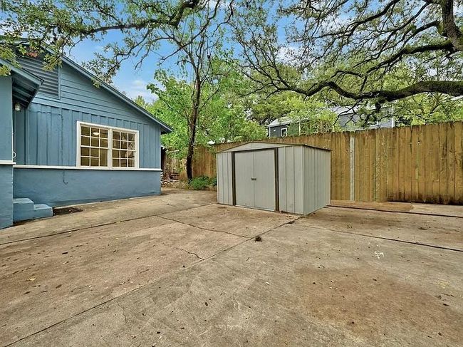 Fenced backyard with a patio area and a storage shed | Image 20