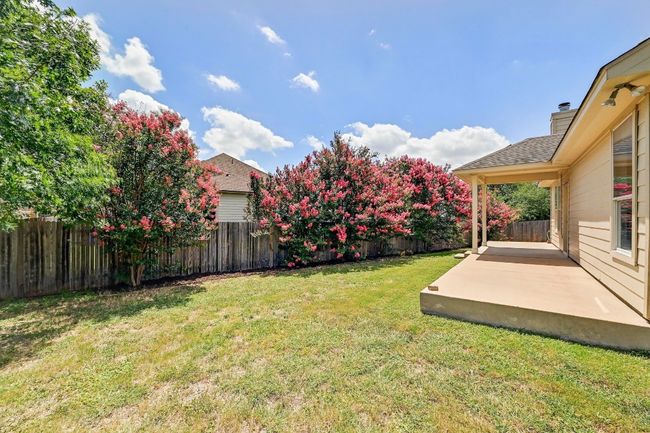 Fenced backyard featuring a patio | Image 24