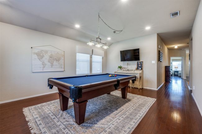 Playroom featuring dark wood finished floors, billiards, and recessed lighting | Image 8