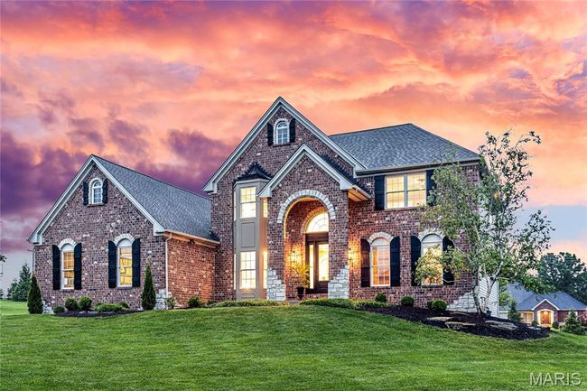 View of front of house with brick siding and a lawn | Image 16