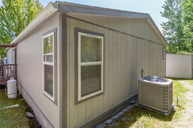Back and east side of the house. Noticed the heat pump? | Image 24