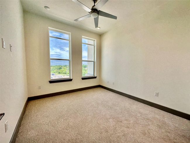 Unfurnished room featuring carpet and ceiling fan | Image 5