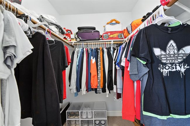 Walk in closet with carpet | Image 27