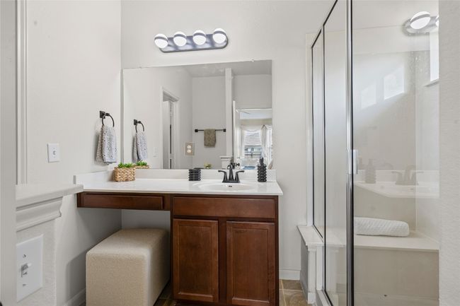 Updated fixtures and lighting in the primary bathroom | Image 17