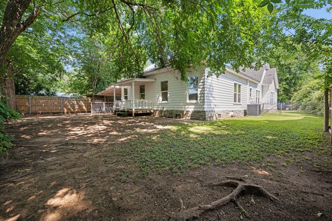 Back of property featuring a fenced backyard. Yard needs grass | Image 26