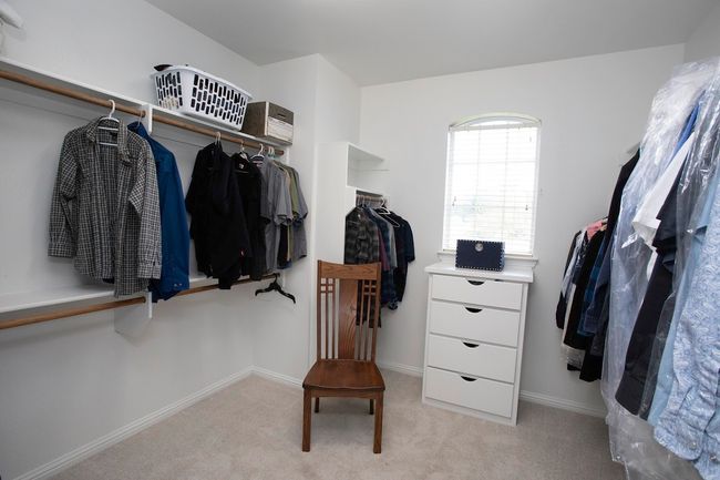 Second bedroom with light carpet and ceiling fan | Image 13