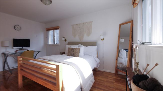 Bedroom featuring wood finished floors | Image 12