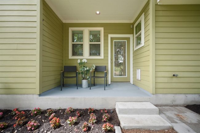 The covered back patio provides a perfect spot to unwind or entertain, offering shade and a tranquil space to enjoy the peaceful greenbelt views | Image 33