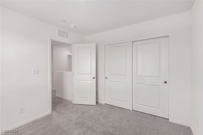 Unfurnished bedroom featuring light carpet, visible vents, baseboards, and a closet | Image 20