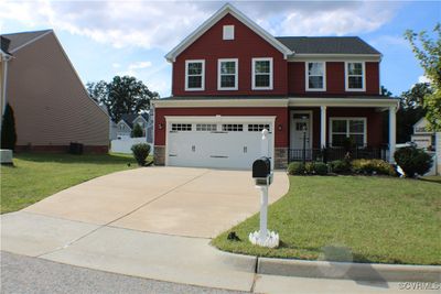 Beautiful home with front porch & full irrigation system! | Image 1