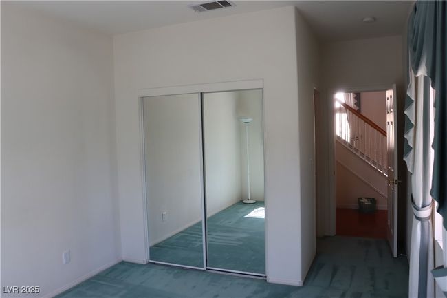 Unfurnished bedroom featuring carpet and a closet | Image 37
