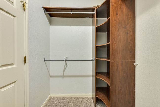 Spacious closet featuring carpet floors | Image 25