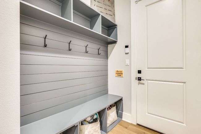 The mudroom includes a built-in mud bench, ideal for storing dirty shoes, jackets, and backpacks. | Image 26