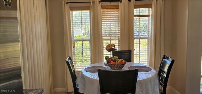 Dining room with baseboards | Image 5