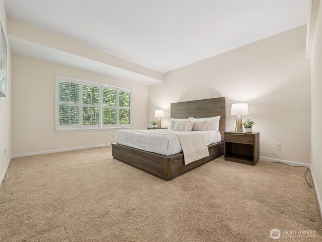 Beautiful year round views of natural greenery from both great room and primary bedroom. | Image 17