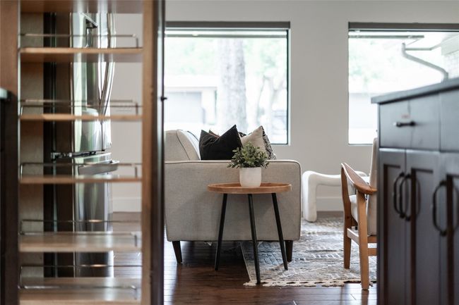 The living room sits along oversized picture windows that showcase the epic Austin sunsets every evening. | Image 12