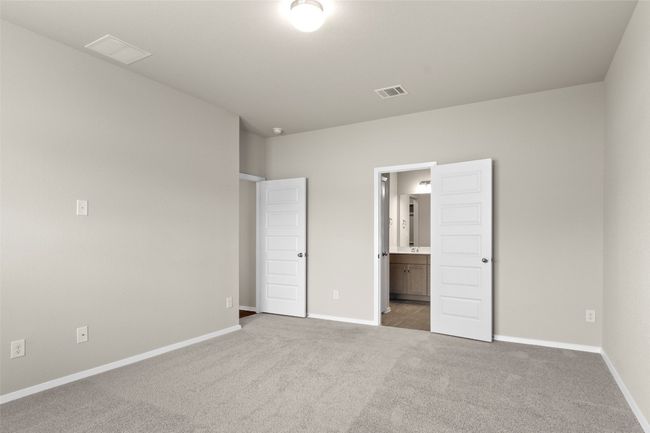 Unfurnished bedroom featuring carpet flooring, baseboards, and visible vents | Image 21