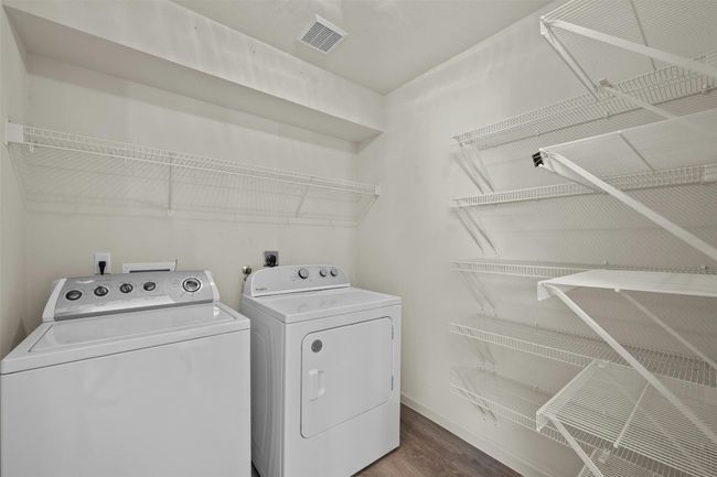 This spacious utility room offers ample storage for bulk items, like those from Costco, and provides convenient space to keep appliances organized and easily accessible. With room for all your essentials, it’s the perfect spot to streamline household storage and maintain a tidy, clutter-free home. | Image 28