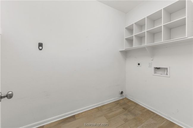 Washroom featuring hookup for an electric dryer, hookup for a washing machine, and light wood-type flooring | Image 28