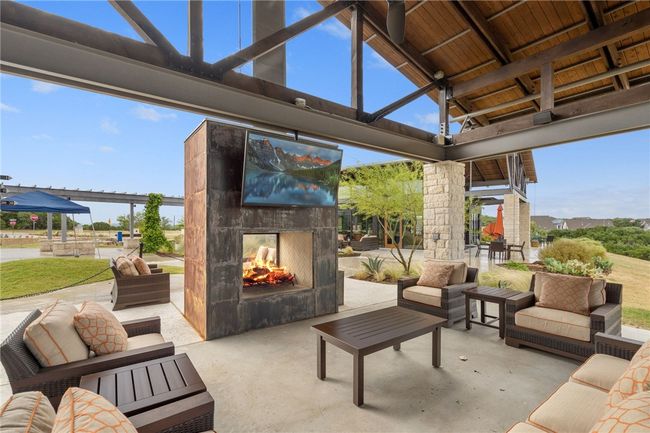 Amenity center has large covered pavilion, double sided fire place, tv, and plenty of room to get comfortable and chill out! | Image 31