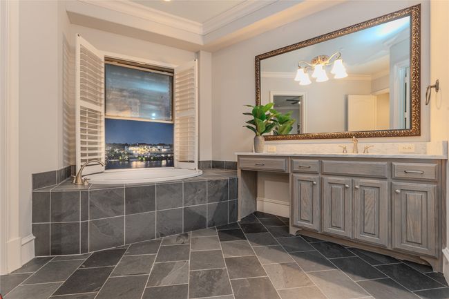 Full bath featuring crown molding, a bath, and vanity | Image 26