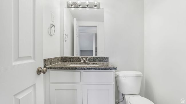 Bathroom with toilet and vanity on main floor | Image 8