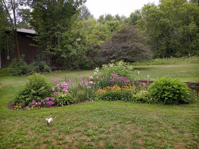 Beautiful perennial gardens bordered by classic retaining walls. | Image 55