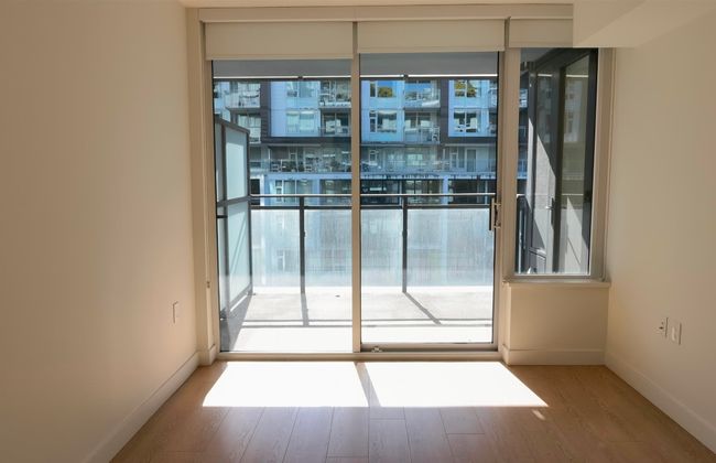 Spare room with plenty of natural light, wood finished floors, and baseboards | Image 7