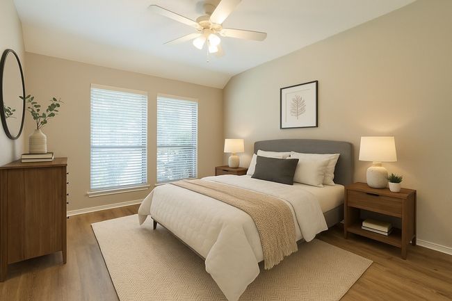 Bedroom featuring ceiling fan, baseboards, and wood finished floors | Image 25