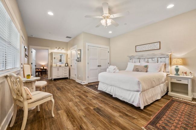 Bedroom with dark wood-style floors, recessed lighting, a ceiling fan, and baseboards | Image 38