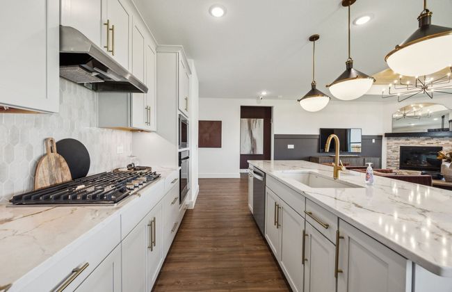 Bright kitchen with an expansive center island perfect for gatherings *Model representation | Image 4