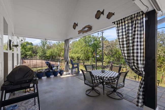 View of patio / terrace featuring outdoor dining space, a grill, and fence | Image 36