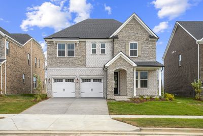 READY NOW!! This gorgeous Ashford floorplan with guest suite downstairs and 3 bedrooms & bonus up is ready for you! *Photos are of actual home.* | Image 1