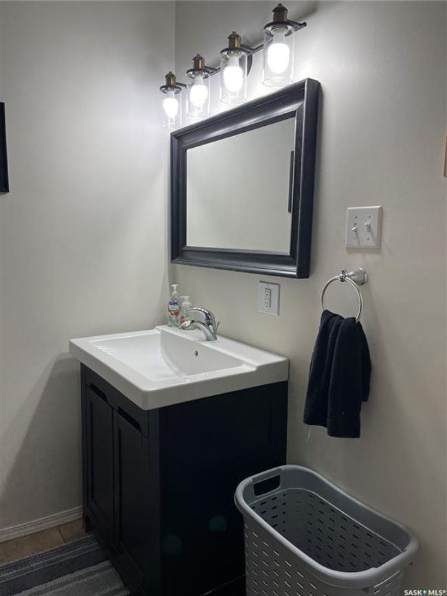 Bathroom with tile patterned floors and vanity | Image 38