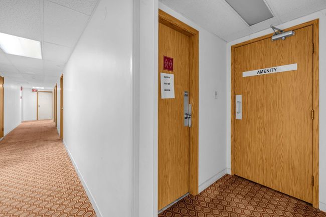 Hallway featuring tile patterned floors, baseboards, and a paneled ceiling | Image 28