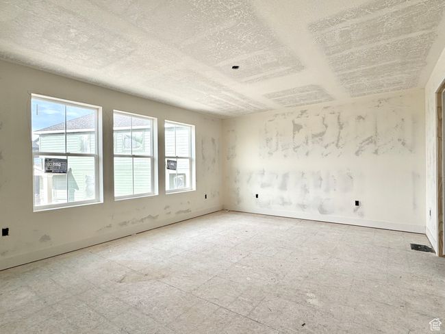 Empty room with a textured ceiling | Image 8