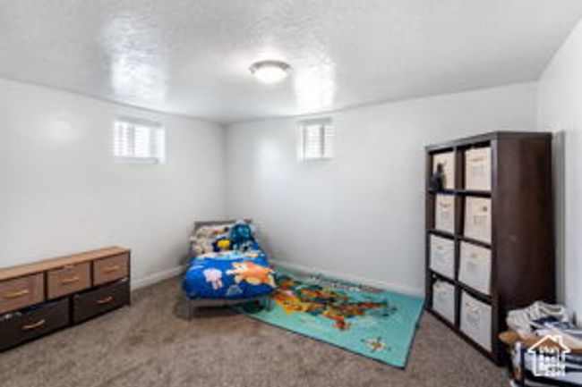 Unfurnished bedroom with carpet flooring and baseboards | Image 17